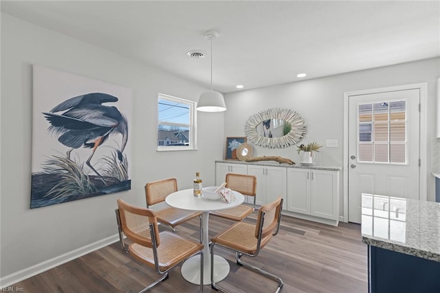 dining area with recessed lighting, wood finished floors, and baseboards