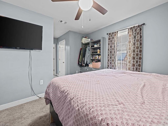 bedroom featuring baseboards, visible vents, carpet floors, and ceiling fan