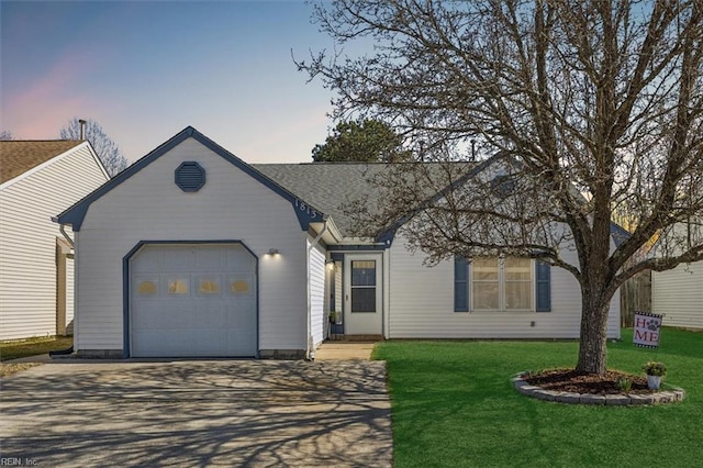 single story home featuring concrete driveway, an attached garage, and a lawn