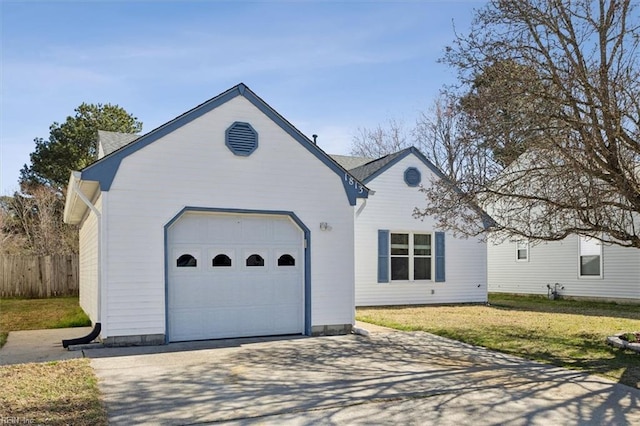 single story home featuring a front yard, an attached garage, driveway, and fence