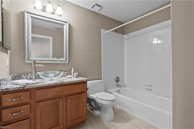 bathroom with tile patterned floors, visible vents, toilet, washtub / shower combination, and vanity