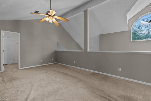 interior space featuring baseboards, lofted ceiling, a textured ceiling, and a ceiling fan