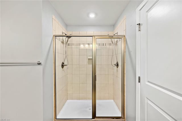 full bathroom featuring a stall shower