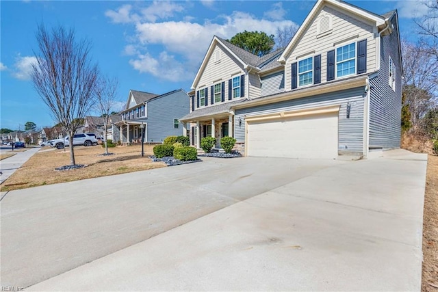 view of front of home featuring concrete driveway and an attached garage