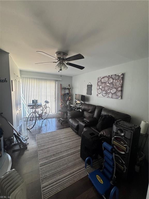 living room with radiator and a ceiling fan