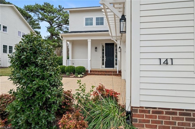 property entrance with a porch