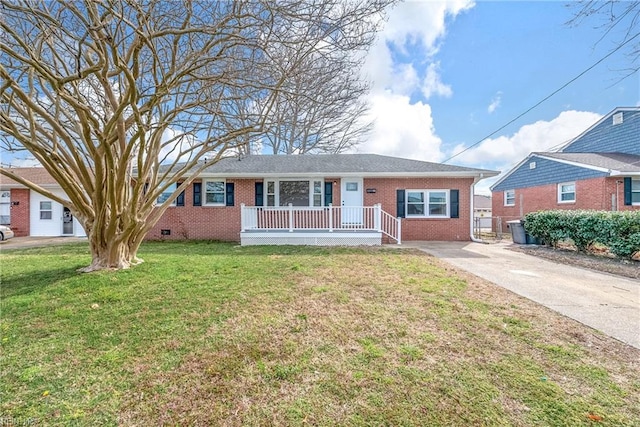 ranch-style home with a front lawn, a porch, brick siding, and driveway