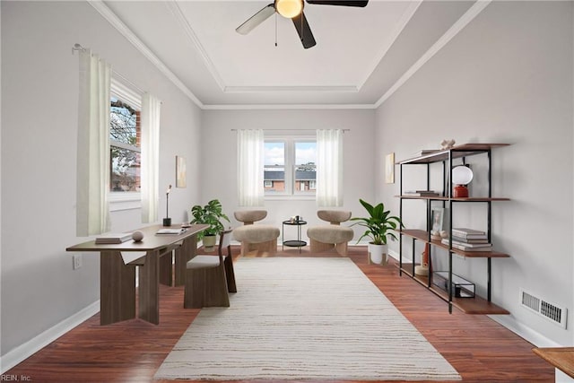 office area with ceiling fan, visible vents, plenty of natural light, and wood finished floors