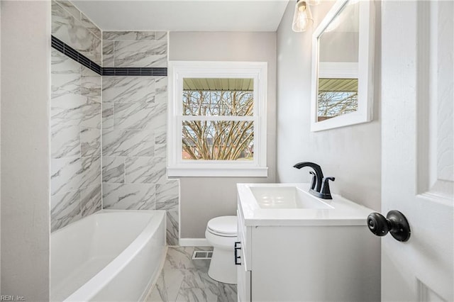 bathroom featuring marble finish floor, toilet, vanity, and baseboards