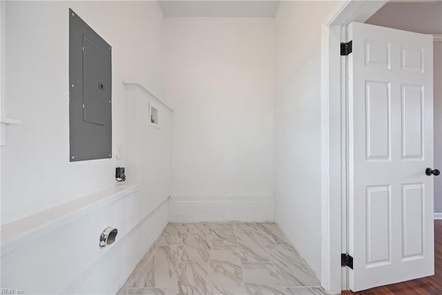 clothes washing area featuring electric panel, marble finish floor, hookup for a washing machine, and laundry area