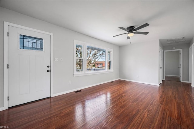 foyer with visible vents, baseboards, wood finished floors, and a ceiling fan