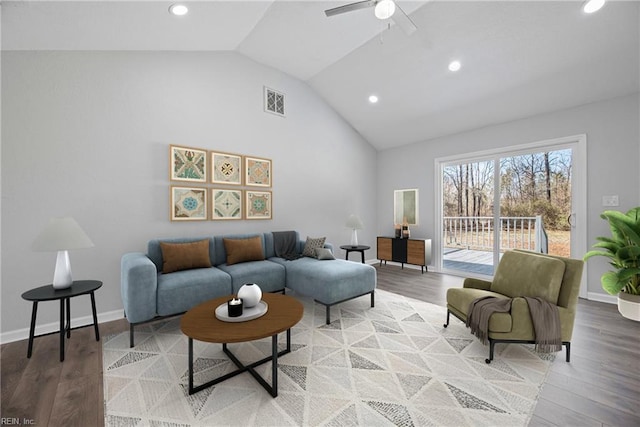 living area featuring visible vents, light wood-style flooring, and baseboards