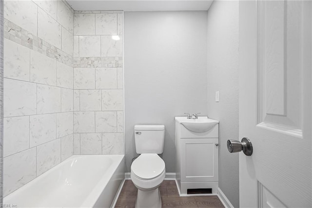 full bath with baseboards, toilet, and vanity