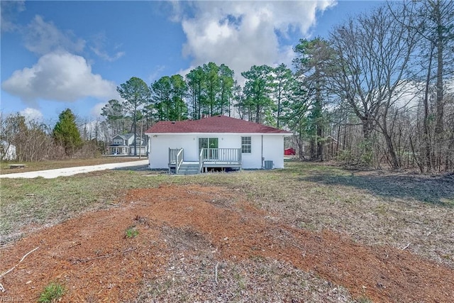 view of front of home featuring central AC unit and a wooden deck