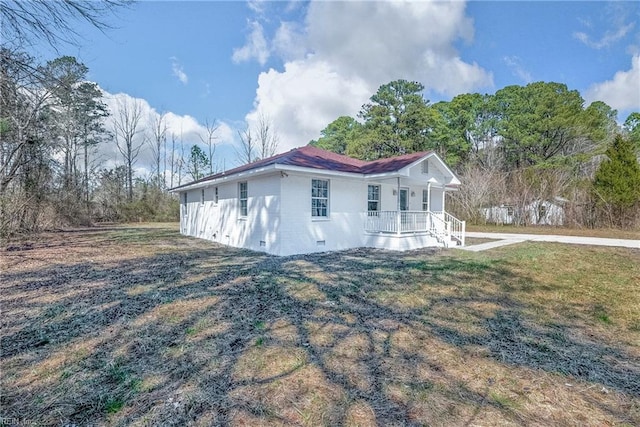 view of property exterior featuring a lawn