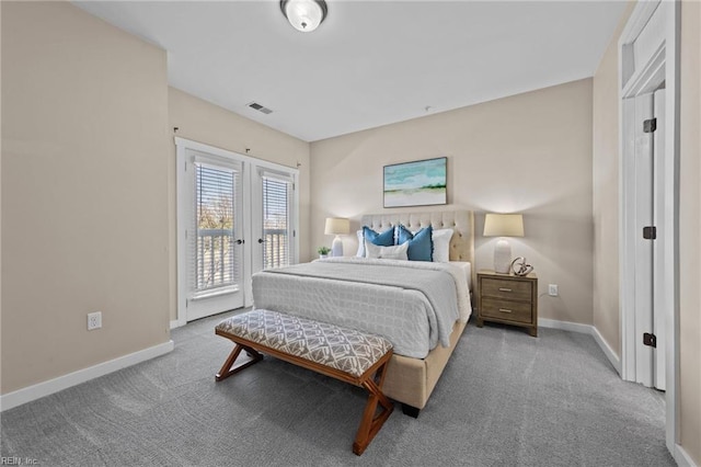 carpeted bedroom with access to exterior, visible vents, and baseboards