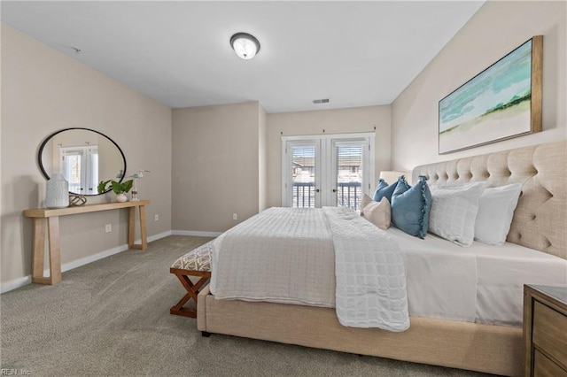 bedroom featuring multiple windows, french doors, baseboards, and carpet