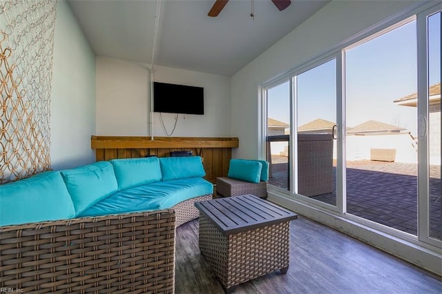 living room with ceiling fan and wood finished floors