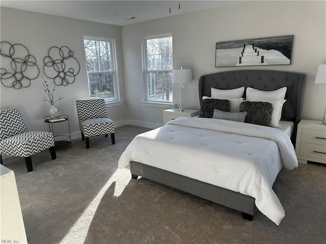 carpeted bedroom with baseboards