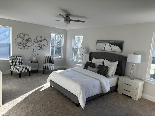 bedroom with baseboards, carpet, and a ceiling fan