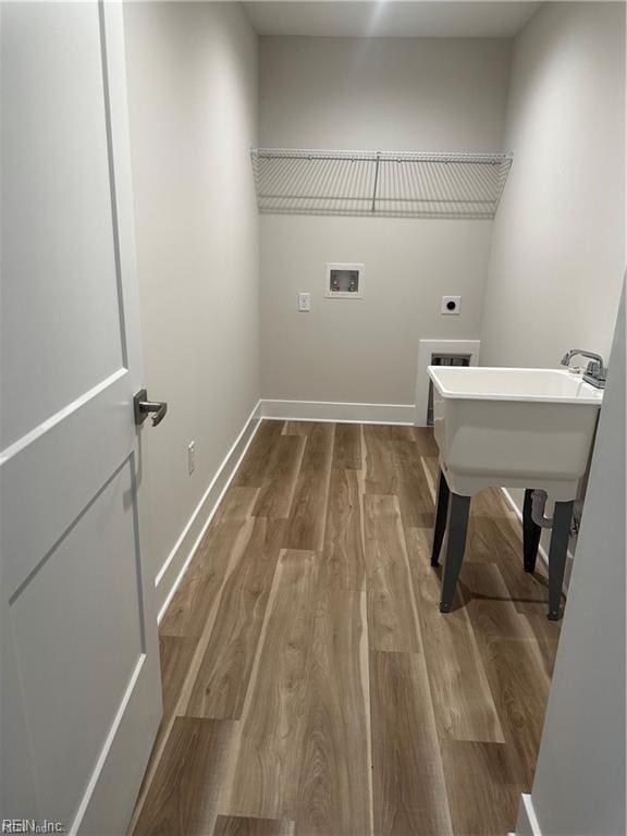 washroom with wood finished floors, baseboards, laundry area, electric dryer hookup, and washer hookup