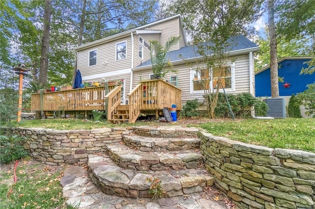 rear view of house featuring a deck