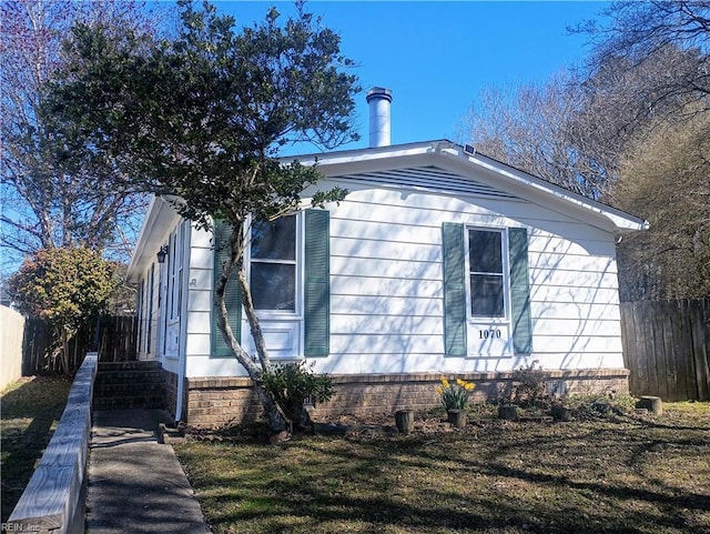 view of side of property with fence