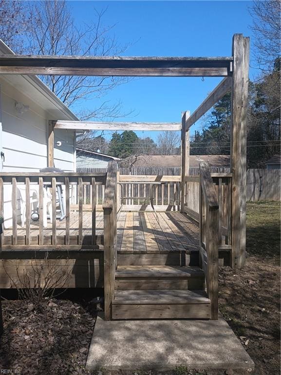 surrounding community with a deck and fence