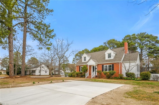 cape cod house with brick siding