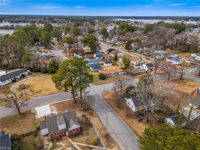 bird's eye view featuring a water view and a residential view