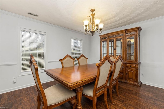 dining space featuring dark wood-style floors and ornamental molding