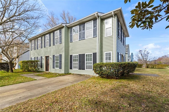 view of side of home featuring a yard