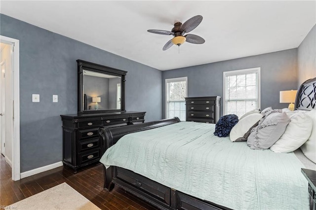 bedroom featuring ceiling fan, baseboards, and dark wood finished floors