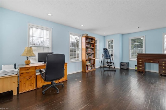 office featuring recessed lighting, wood finished floors, baseboards, and a textured ceiling