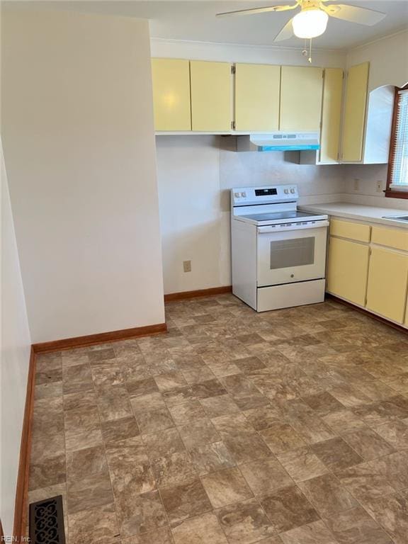 kitchen featuring under cabinet range hood, electric range, cream cabinets, and light countertops