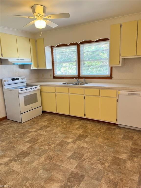 kitchen featuring white appliances, cream cabinetry, light countertops, and a sink