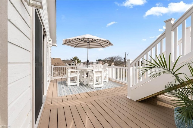 wooden deck with outdoor dining area