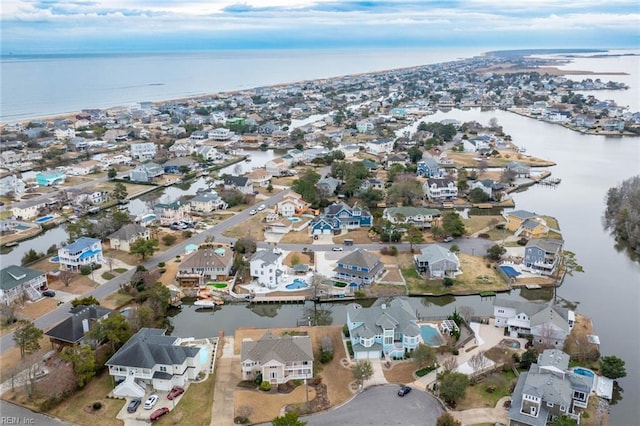 bird's eye view featuring a residential view and a water view