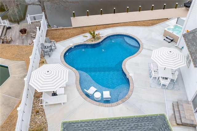 pool featuring a patio area and fence