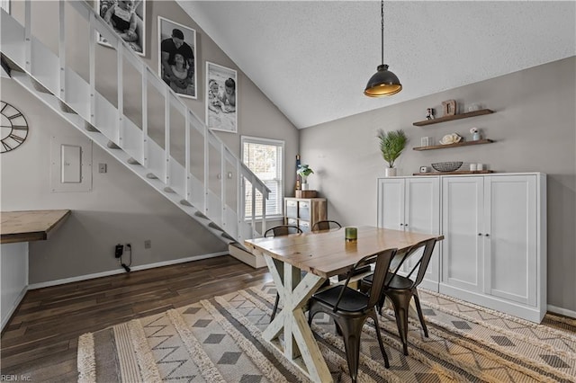 dining space with a textured ceiling, light wood finished floors, baseboards, stairs, and vaulted ceiling