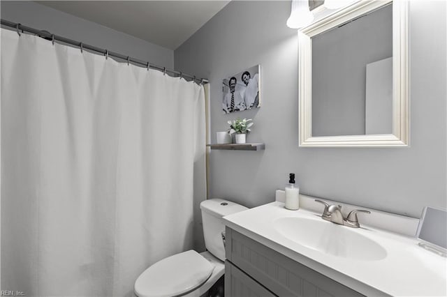 full bathroom featuring toilet and vanity