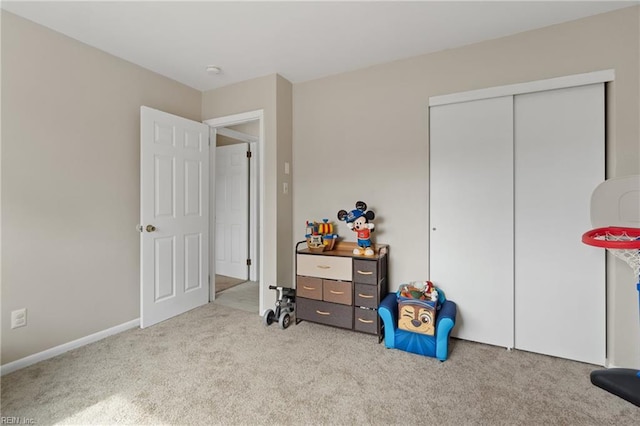 carpeted bedroom featuring a closet