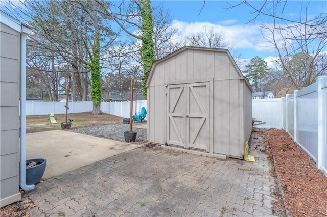 view of shed with a fenced backyard