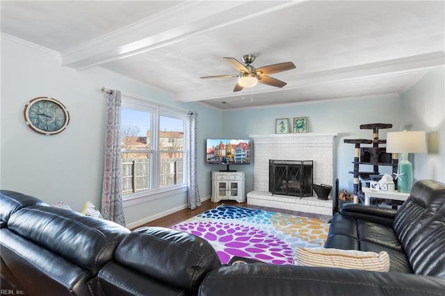 living room featuring beam ceiling, crown molding, wood finished floors, and baseboards