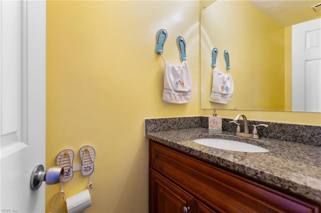 bathroom with visible vents and vanity