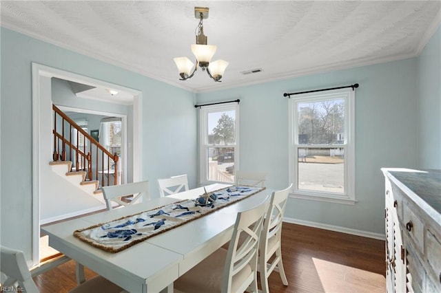 dining room with stairway, dark wood-style floors, visible vents, baseboards, and a chandelier