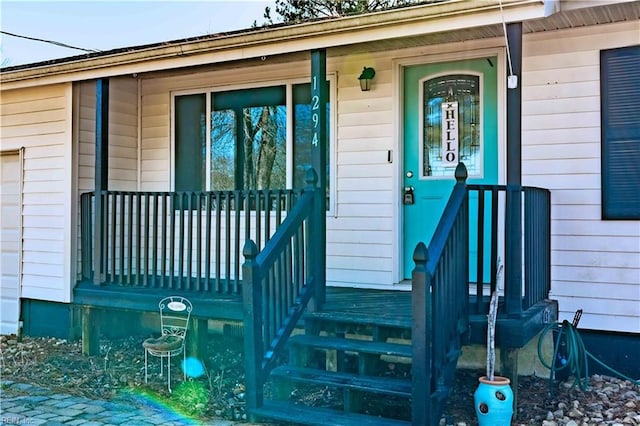 entrance to property featuring a porch