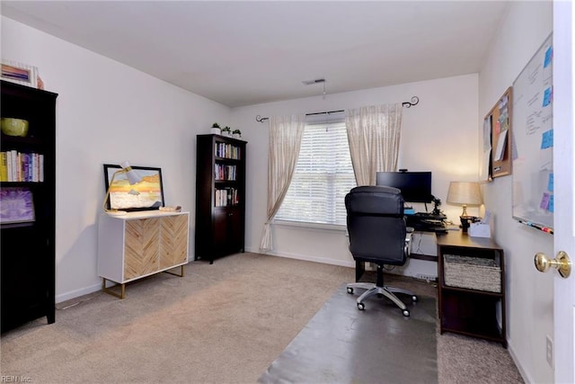 office space featuring visible vents, carpet, and baseboards