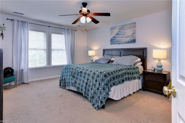 bedroom with visible vents, carpet floors, baseboards, and ceiling fan