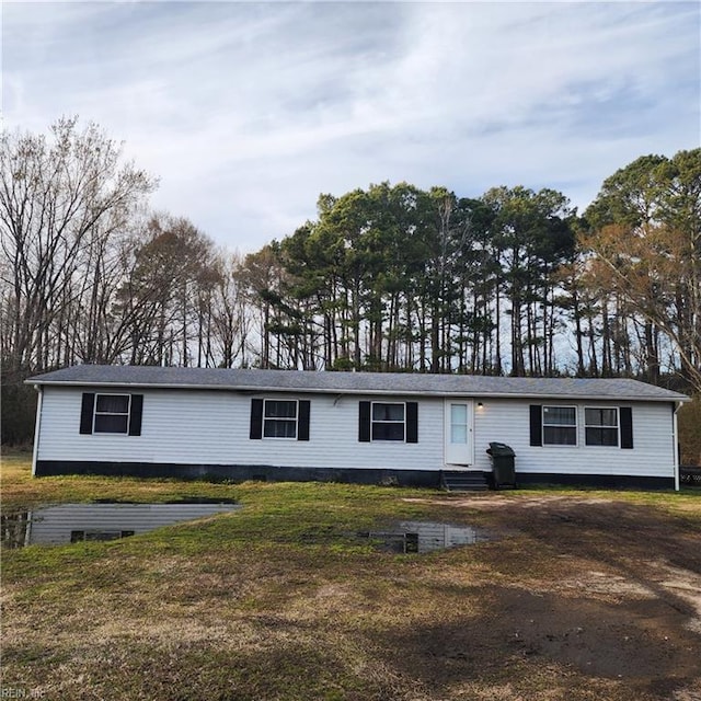 view of front of house with a front yard and entry steps